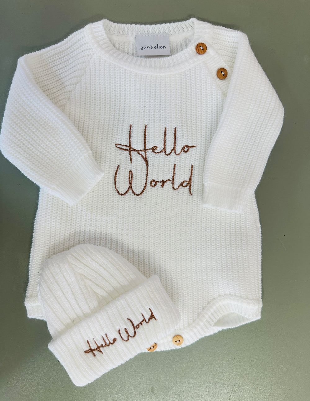 White and taupe ribbed knit baby romper with matching hat and embroidered Hello World design – Newborn to 0–3 Months