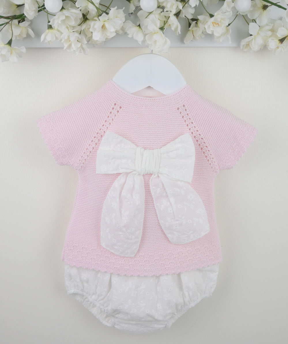 Pex Sylvie pink knitted baby outfit featuring a broderie anglaise bow on the top with matching trousers – suitable for newborn to 12 months