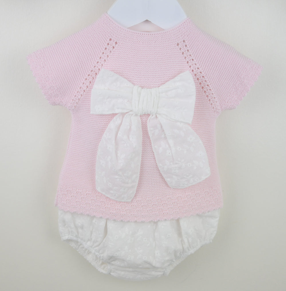 Pex Sylvie pink knitted baby outfit featuring a broderie anglaise bow on the top with matching trousers – suitable for newborn to 12 months