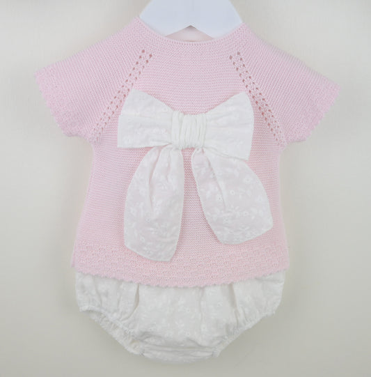 Pex Sylvie pink knitted baby outfit featuring a broderie anglaise bow on the top with matching trousers – suitable for newborn to 12 months