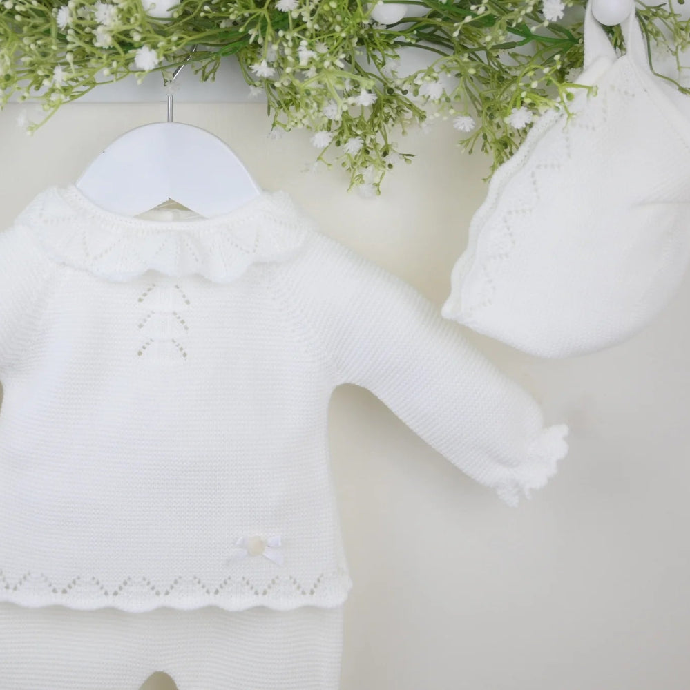 Pink 3-piece knitted baby outfit by Pex with bonnet, frill collar, and footed trousers – also available in white and beige