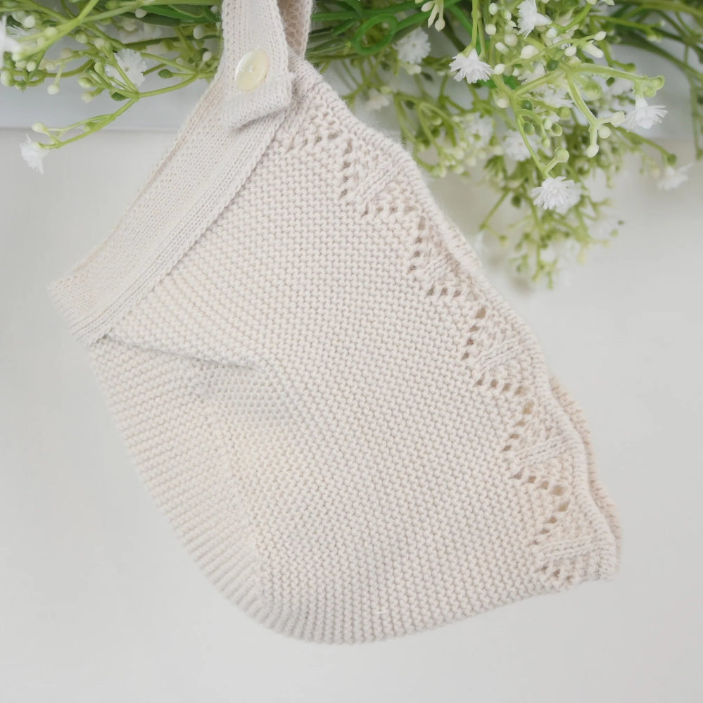 Pink 3-piece knitted baby outfit by Pex with bonnet, frill collar, and footed trousers – also available in white and beige