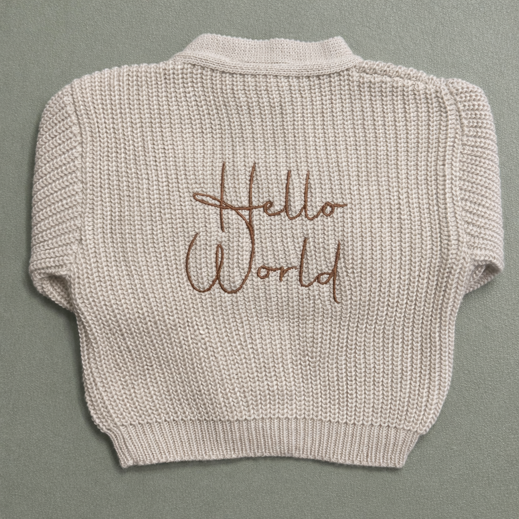 Dandelion Hello World Knitted Baby Cardigan (Newborn – 0–3 Months)