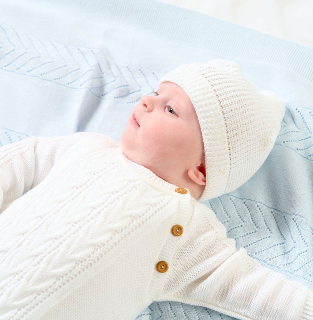 Knitted white baby romper and hat set by Dandelion, perfect for newborns