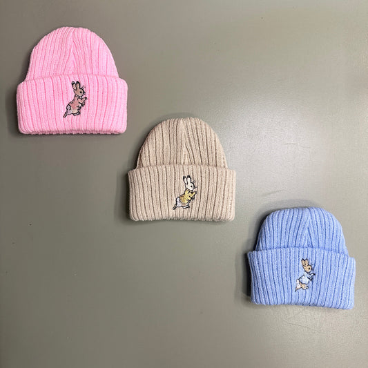 Newborn cable knit baby hat with embroidered rabbit – available in pink, beige, and blue