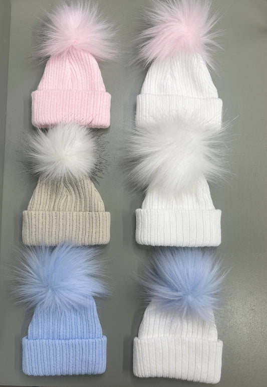 Baby Pom Pom Hats in pink, white, taupe, and blue with fluffy poms – cosy winter accessories