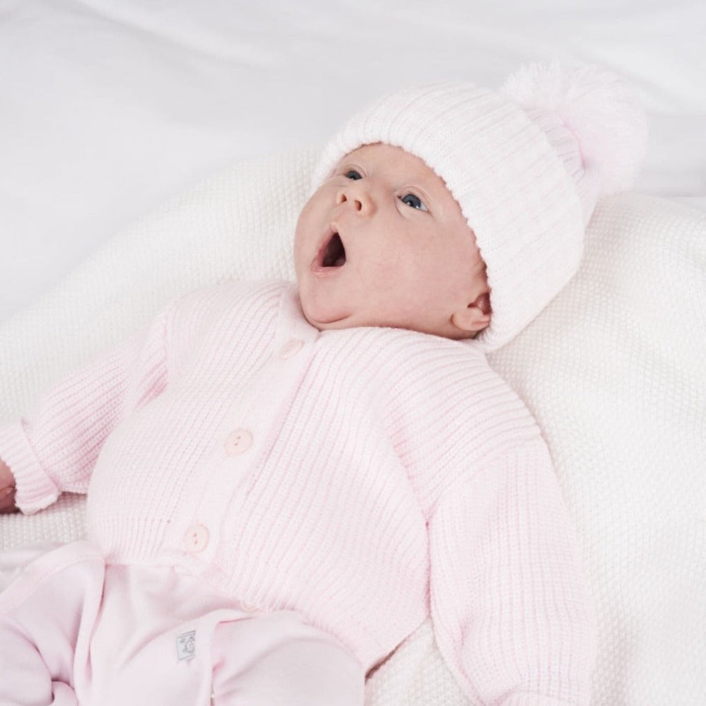 Pink ribbed knitted baby cardigan with v-neck and three-button fastening – suitable from premature to 3–6 months