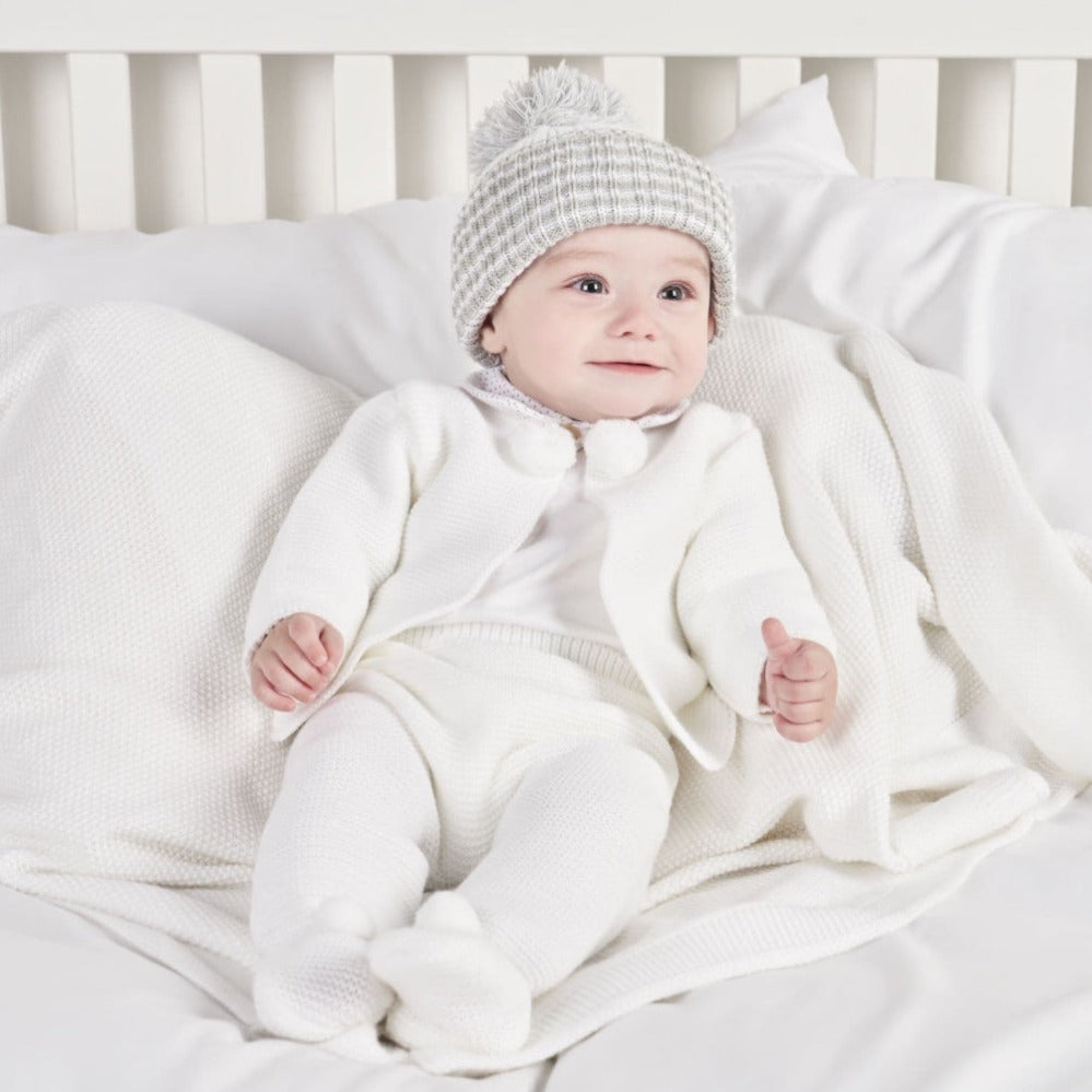 Dandelion baby knitted outfit with pom pom details – jacket and leggings in white