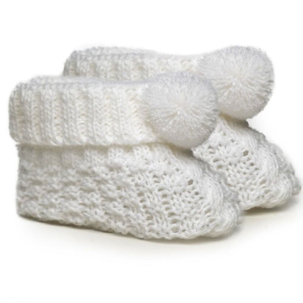 White knitted baby booties with pom pom detailing – newborn size