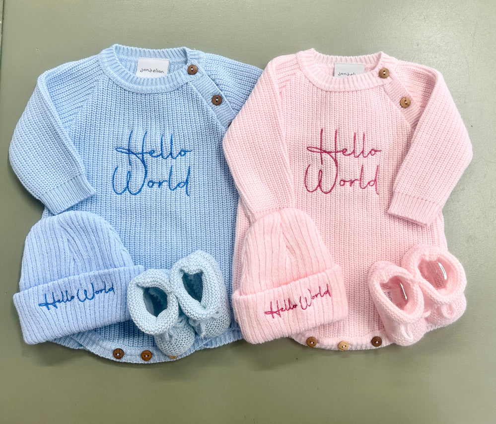 Blue and pink ribbed knit baby rompers with hats featuring embroidered Hello World – Newborn to 0–3 Months