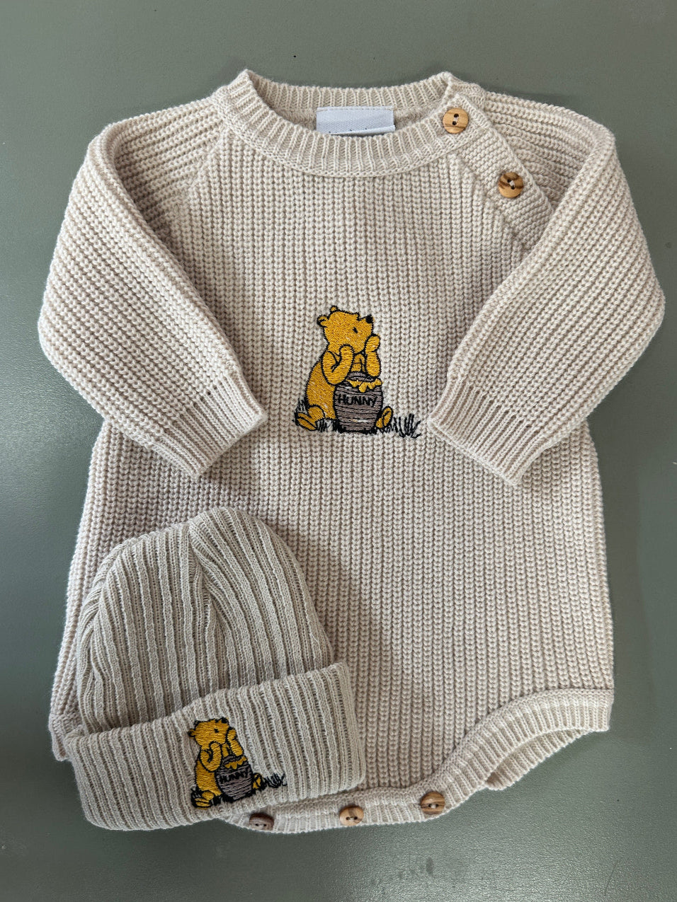 Taupe and white ribbed knit baby romper with hat and embroidered bear motif – Newborn to 0–3 Months