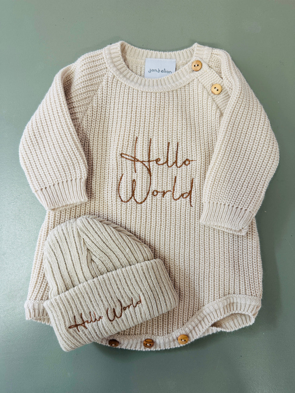 White and taupe ribbed knit baby romper with matching hat and embroidered Hello World design – Newborn to 0–3 Months