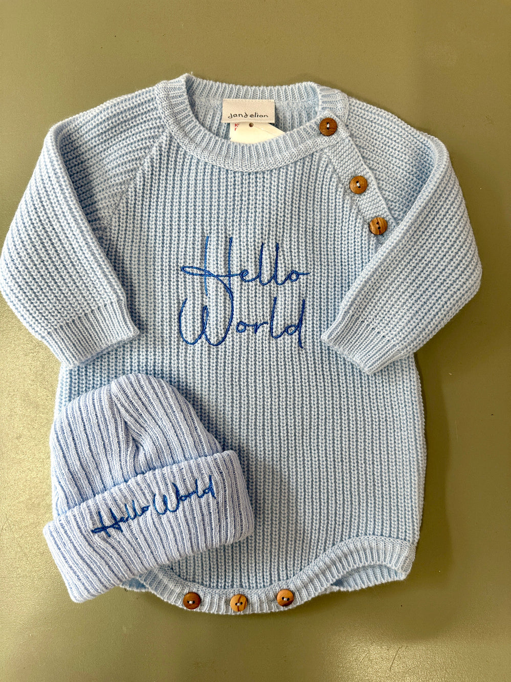 Blue and pink ribbed knit baby rompers with hats featuring embroidered Hello World – Newborn to 0–3 Months