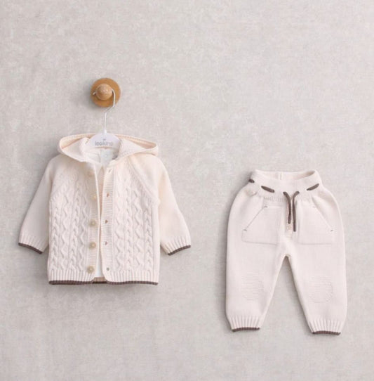 Flat lay of Leoking 2-piece knitted baby set in natural colour, featuring a cable-knit hooded cardigan and matching joggers with drawstring waist.
