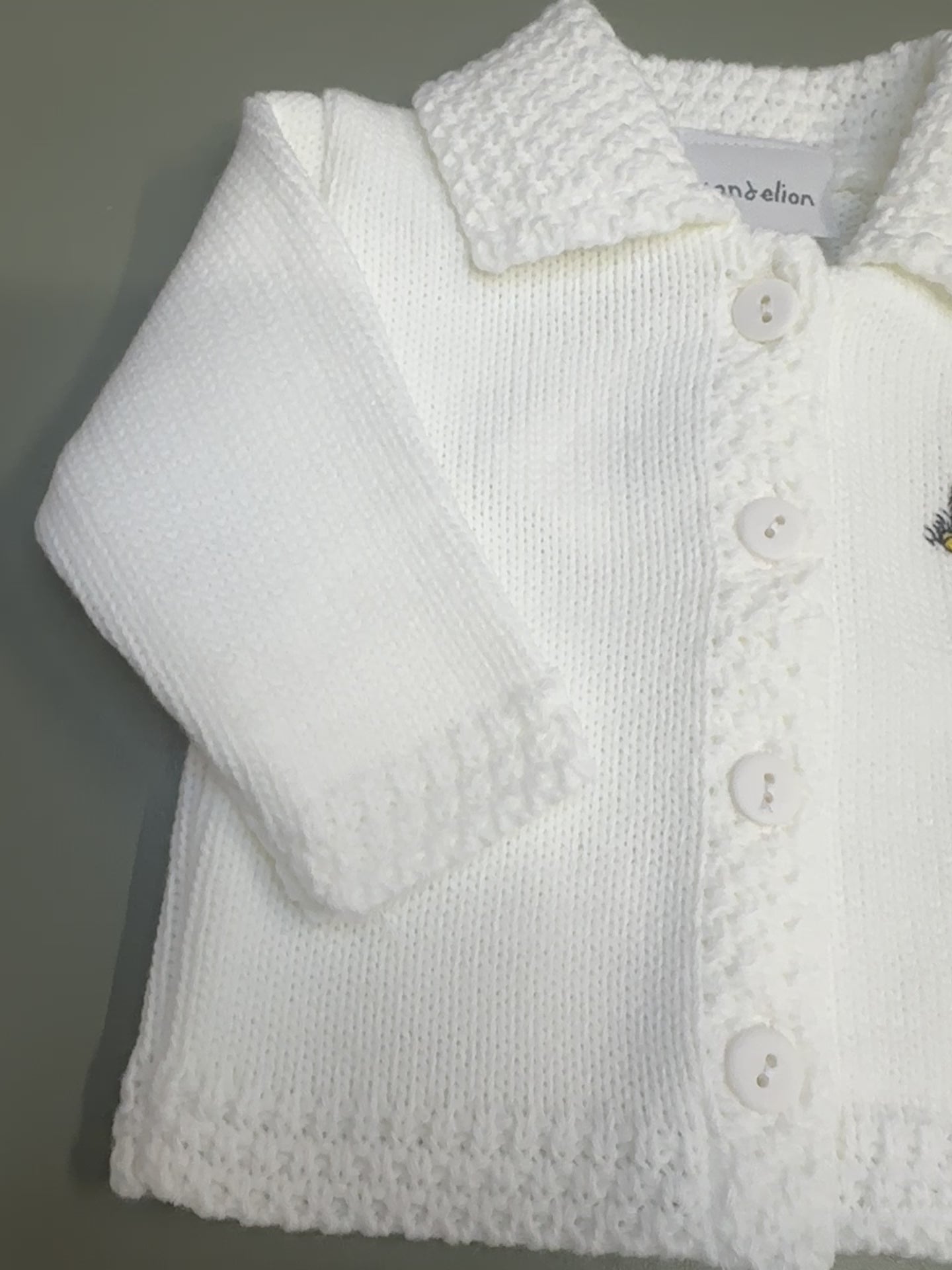 White Dandelion baby cardigan with embroidered bear and button front – newborn to 12 months